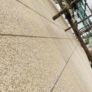 鹰潭 黄金麻花岗岩荔枝面外墙干挂石材效果示例